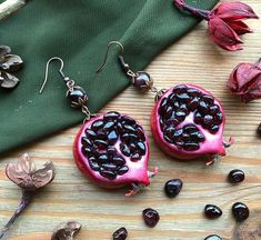 Garnet Pomegranate Earrings Chunky Fruit earrings Round Dark Red earrings Luxury Garnet jewelry Long evening earrings Festive trendy jewelryOriginal chunky Luxury  earrings with natural garnet (inside pomegranate and beads in top)Diameter of pomegranate 3,5cm (1.18")full length 7cm (2.7")Please attention! This earrings not very lightweight because with a lot of natural gemstones! For lovers of chunky earrings! all items from my garnet pomegranate collectiongarnet pomegranate ring https://www.ets Handmade Burgundy Earrings For Gift, Handmade Garnet Drop Earrings, Garnet Pomegranate, Pomegranate Ring, Dark Red Earrings, Pomegranate Necklace, Pomegranate Earrings, Corporate Goth, Evening Earrings