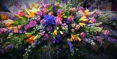 a bunch of flowers that are sitting on a table