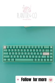 a green keyboard sitting on top of a blue table