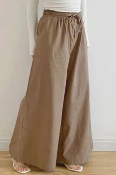 These High-Waisted Loose Pants feature a drawstring for adjustable comfort and a relaxed fit. With built-in pockets and a solid color, they combine practicality with a modern, easygoing style. Ideal for a chic, comfortable look in any casual setting Khaki Drawstring Bottoms For Spring, Khaki Bottoms With Drawstring For Spring, Brown Cotton Bottoms Solid Color, Spring Khaki Drawstring Bottoms, Spring Khaki Bottoms With Drawstring, Brown Cotton Bottoms With Solid Color, Non-stretch Full Length Drawstring Bottoms, Solid Wide Leg Pants With Drawstring For Fall, Fall Wide Leg Pants With Drawstring In Solid Color