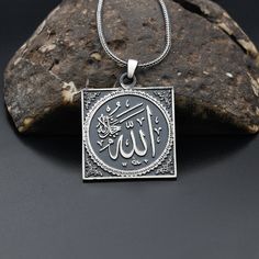 Allah Engraved Necklace, 925 Sterling Silver Necklace, Religious Silver Necklace, Handmade  Necklace ✦ Details ✦ * Material: 925 Sterling Silver * Weight of pendant : 6,30  gram *  Chain Weight :     20 Inches = 5.00 Gr     22 Inches = 5.60 Gr     24 Inches = 6.05 Gr     26 Inches = 6.10 Gr     28 Inches = 6,40 Gr * Sides oxidized * Stamp: 925 ✦ Shipping ✦ * Processing time: 1-3 business days. * This item ships from my Turkish workshop in Istanbul. * Add your phone number in address box for a sm Sterling Silver Pendant Charm Necklace, Sterling Silver Hallmarked Pendant Charm Necklaces, Sterling Silver Hallmarked Pendant Charm Necklace, Silver Medallion Necklace In Symbolic Style, Silver Symbolic Round Pendant Necklace, Symbolic Engraved Sterling Silver Necklaces, Sterling Silver Engraved Square Pendant, Stamped 925 Pendant Charm Necklace As Gift, Stamped 925 Silver Pendant Charm Necklace For Gift