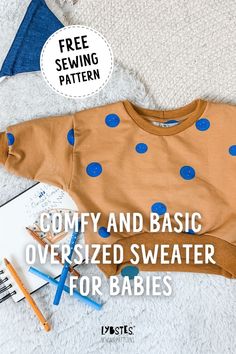 a sweater with blue polka dots on it and the words comfy and basic over sized sweater for babies