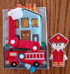 a red fire truck and a small felt toy