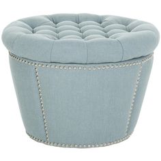 a light blue ottoman with studded trim