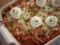 a casserole dish with pasta, cheese and sour cream