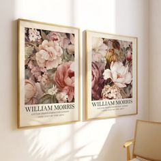 two framed posters on the wall above a chair