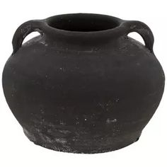 a black vase with handles is shown on a white background