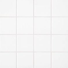 a white tiled wall with no one in the photo or description on this page to describe