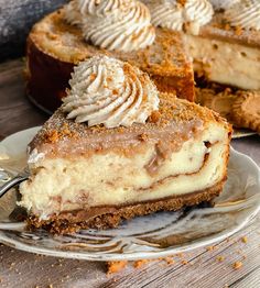 a slice of cheesecake on a plate with a fork next to it and another pie in the background