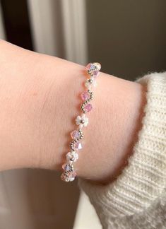 A beautiful handmade bracelet with an alternating flower and vine pattern, available in silver or gold and they come in a variety of colours. This bracelet makes the perfect gift for any occasion, and gives a magical vibe to any outfit! The crystals have a stunning iridescent effect, and can be seen in slightly different colours depending on the lighting and angle. They are all reflective so that they glisten and sparkle beautiful colours in the light, to give a true magical feeling to the wearer. My bracelets are made to order and are packaged in a gift box with ribbon. I craft my items with quality materials, using glass beads and silver or gold plated hardware.  Please keep the bracelet dry, as getting it wet can cause discolouration and wear. All bracelets feature lobster clasps and ha Vine Bracelet, Handmade Gifts For Women, Fantasy Jewellery, Women Nature, Handmade Fairy, Vine Pattern, White Bracelets, Beautiful Colours, 24kt Gold