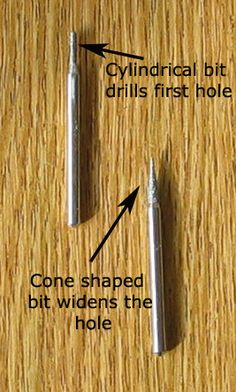 two screws are shown on the table and one has an arrow pointing to it