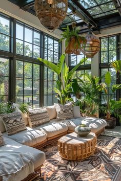 a living room filled with lots of furniture and plants on top of it's walls