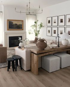 the living room is clean and ready for us to use it's natural wood flooring