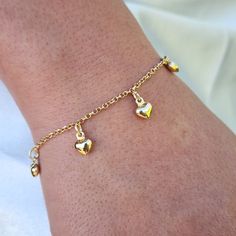 ❤️ Beautiful solid 14k yellow gold Hearts Bracelet. Perfect for everyday and every occasion. Modern, versatile and everlasting. This hanging hearts Bracelet is so cute you will never want to take it off. 14k gold will not tarnish or rust.  ❤️ Materials: solid 14k yellow gold Lenght: 7 Inches Width: 2mm Weight: 3.6 grams (approximately) 14k stamped Brand new ❤️ Pictures are zoomed to capture all the details, the last picture is not zoomed it will help you to have a better size reference of this p Hanging Bracelets Gold, Gold Heart Bracelet With Heart Charm Gift, Gold Plated Heart Charm Bracelet, Adjustable Gold Plated Heart Bracelet, Gold-plated Heart Bracelet With Heart Charm, Gold-plated Heart Charm Bracelet, Hearts Bracelet, Gold Arm Band, Gold Heart Bracelet