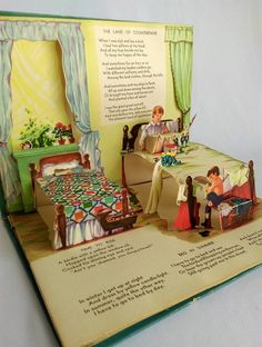 an open children's book showing the inside of a bedroom