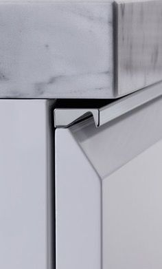 a close up view of the door handle on a refrigerator