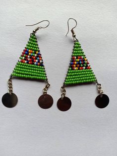 Handmade Beaded Earrings - Colorful, Lightweight, and Stylish! ✨ 🌿 Features: **Handcrafted: Each pair is meticulously made using high-quality seed beads. **Boho-Inspired Design: Ideal for those who adore bohemian, festival, or earthy styles. **Lightweight & Comfortable: Perfect for everyday wear or special occasions without causing discomfort. **Vibrant Colors: Choose from a variety of colors to match any wardrobe. **Perfect Gift: Great for birthdays, anniversaries, or as a thoughtful gift for Traditional Green Beaded Earrings For Festivals, Festive Green Beaded Earrings, Handmade Round Beaded Earrings For Festivals, Green Beaded Dangle Earrings For Festive Occasions, Traditional Green Beaded Dangle Earrings, Festive Green Earrings With Colorful Beads, Polished Bead Earrings For Festivals And Gifts, Traditional Polished Bead Earrings For Gift, Festival Earrings With Polished Beads As Gift