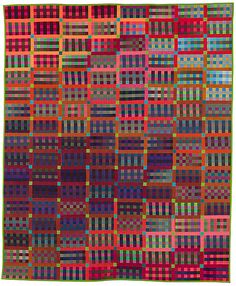 a colorful quilt with squares and lines on it