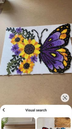 an image of a butterfly and flowers on a table with the words visual search below it