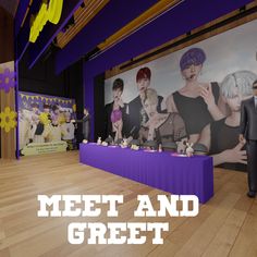 a man standing in front of a table with dolls on it and the words meet and greet