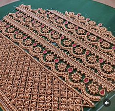 an intricately designed table cloth with beads on it