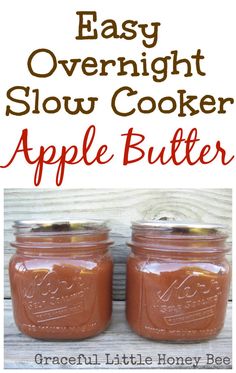 two mason jars filled with apple butter and the words easy overnight slow cooker apple butter