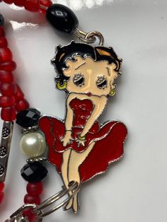 Vintage Betty Boop necklace , red and black beads Party Red Beaded Necklaces With Black Beads, Red Necklace With Black Beads For Party, Retro Red Necklace For Party, Handmade Retro Red Beaded Necklaces, Handmade Red Retro Beaded Necklaces, Gift Red And Black Beaded Necklaces, Red And Black Beaded Necklaces For Gifts, Red And Black Beaded Necklace For Gift, Handmade Red Beaded Retro Necklace