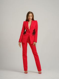 Tia Dorraine masters the art of modern tailoring with this bright red power suit.  The fully lined light blazer is made from a luxurious stretch cotton blend fabric in a form-fitting, single-breasted style with sharp shoulders, seamlessly integrated flap pockets and a same-fabric button for a contemporary touch.  Showcasing the brand's impeccable craftsmanship, the style is accented with contrasting black embroidery placed on both sides over the seamlessly integrated flap pockets which gives thi Pink Power Suit, Blazer With Embroidery, Sharp Shoulders, Modern Tailoring, Light Blazer, Classic Tailoring, Red Trousers, Red Power, Pink Trousers