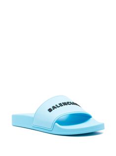 Balenciaga raised-logo Slides - Farfetch Casual Logo Slides For Spring, Logo Open Toe Slides For Spring, Modern Logo Sandals For Summer, Modern Sandals With Logo For Summer, Logo Slides For Beach With Open Toe, Casual Sandals With Embossed Logo For Summer, Casual Summer Sandals With Embossed Logo, Modern Blue Slides For Summer, Casual Open Toe Logo Slides