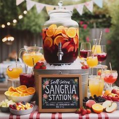 an outdoor sangria station with fruit and drinks