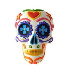 a colorful sugar skull with hearts and flowers painted on it's face is seen against a white background