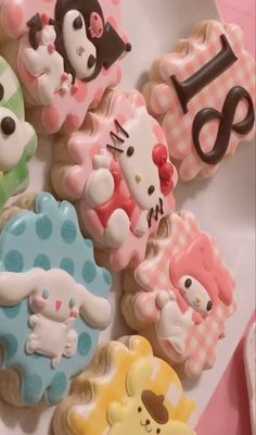 hello kitty cookies are arranged on a plate