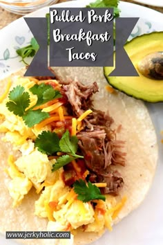 pulled pork breakfast tacos on a plate with avocado