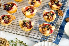 small pastries are sitting on a cooling rack