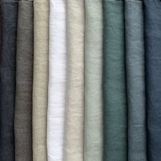 many different colored linens are lined up together