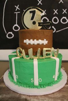 a football themed birthday cake with the number seven on it's top and name spelled out in gold