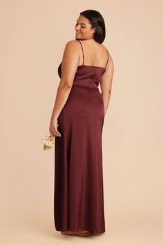 Steal the show in this chic matte satin bridesmaid gown, complete with an asymmetric neckline and column wrap slit skirt. Available in Cabernet. Experiment with modern cuts in our Jennifer dress. Crafted in matte satin, this style has an asymmetrical neckline for a chic (and unique) look. | Cabernet Bridesmaid Dress Matte Satin Size 1X | Birdy Grey Jennifer Berry Bridesmaid Dresses, Copper Bridesmaid Dresses, Satin Bridesmaids Gowns, Terracotta Bridesmaid, Mulberry Bridesmaid Dresses, Classic Bridesmaids Dresses, Jennifer Dress, Bridesmaid Dress Chiffon, Convertible Bridesmaid Dress