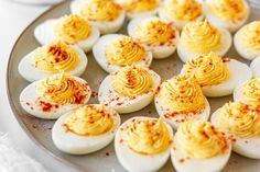 deviled eggs with mustard on a plate