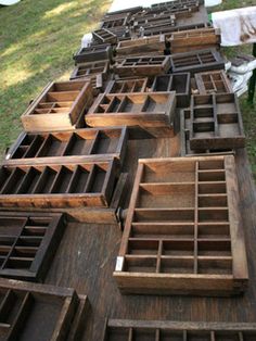 many wooden boxes are lined up on the ground