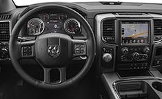 the interior of a truck with dashboards and steering wheel controls