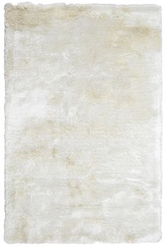 an area rug with white fur on it