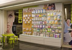 the store is stocked with various products and people sitting at tables in front of it