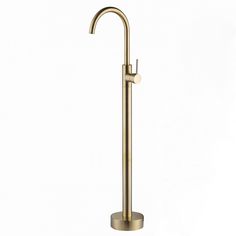 a brass colored bathroom sink faucet with round spout