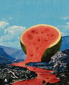 a slice of watermelon on top of a mountain