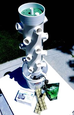 a white table topped with a tall stack of cups