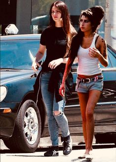 two young women walking down the street