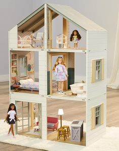 a doll house with two dolls in it