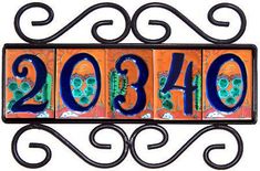 a metal sign with numbers and designs on it