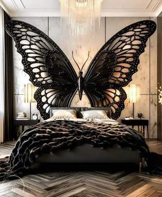 a bedroom with a large butterfly on the wall