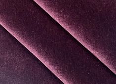 a close up view of a purple velvet fabric with very thin lines on the edges